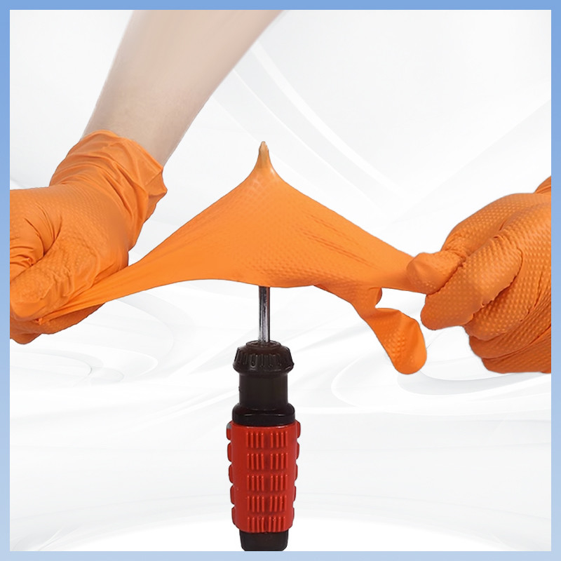 Des gants à nitrile jetables à motif orange épaissis sans poudre pour le travail de protection quotidienne
